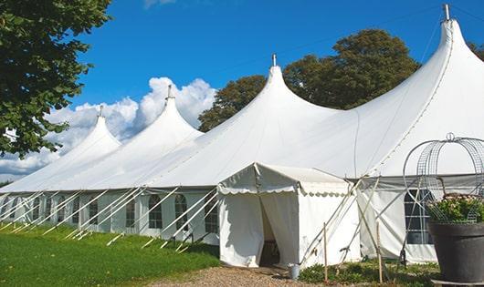 a line of sleek and modern portable restrooms ready for use at an upscale corporate event in Concord